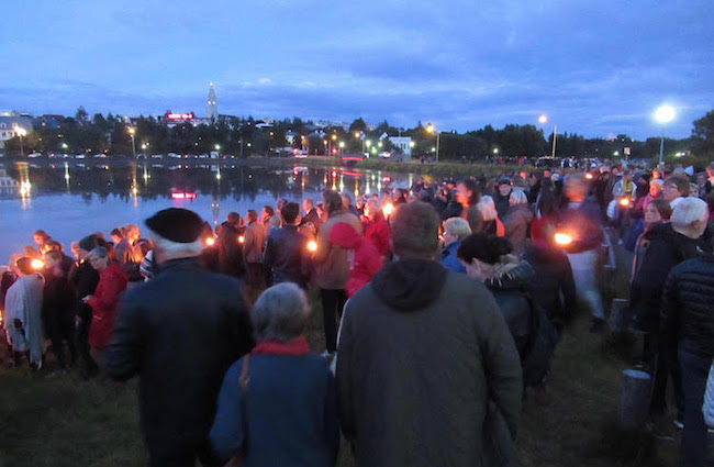 Photo: A candle-floating ceremony in memory of Hiroshima and Nagasaki in which three officials of the Japanese embassy in Reykjavik participated. One of the speakers said there was now a great need for the Icelandic peace movement to encourage the Icelandic government to sign and ratify the Treaty on the Prohibition of Nuclear Weapons. Credit: Lowana Veal | IDN-INPS