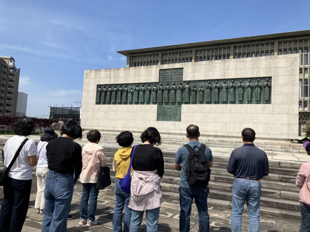 Photo: Korean pilgrims at 26 Martyrs monument Credit: National Catholic Register